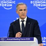 Mark Carney speaking at a podium during the World Economic Forum's Annual Meeting in Davos 2026, featuring a blue background with the "World Economic Forum" logo.