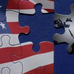 A jigsaw puzzle where the pieces show the American flag, with a missing piece being replaced by a dark piece featuring a map of the Middle East