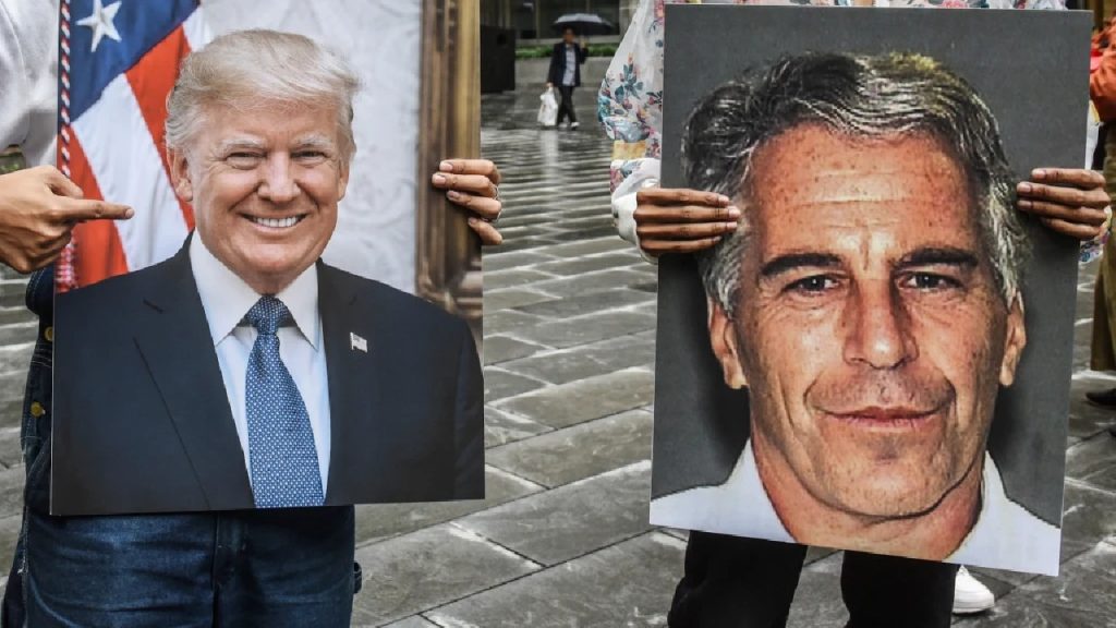 Two people in a public space holding up large placards: one featuring a smiling portrait of Donald Trump and the other a mugshot of Jeffrey Epstein.