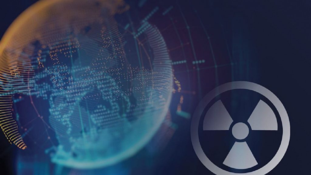 A digital globe made of light particles next to a large grey radioactive symbol.