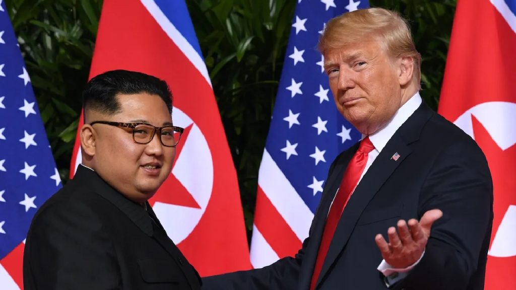 US President Donald Trump and North Korean leader Kim Jong Un shaking hands during a high-stakes diplomatic summit.