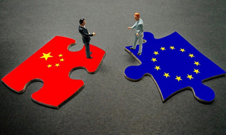 A conceptual image featuring two puzzle pieces with the flags of China and the European Union, with two small human figures standing on them facing each other.