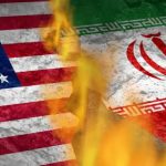 A conceptual image showing the USA and Iran flags separated by a deep, fiery crack in a stone surface.