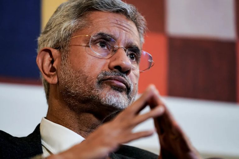 Close-up portrait of Subrahmanyam Jaishankar, India's Minister of External Affairs, looking thoughtful with his hands clasped.