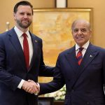JD Vance shaking hands with Shehbaz Sharif during an official diplomatic meeting.