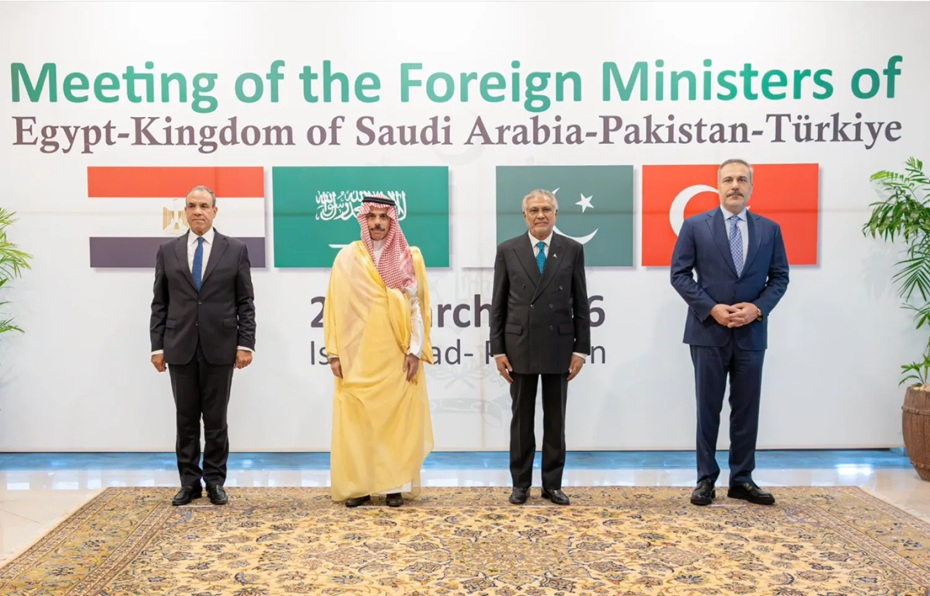 Foreign Ministers of Egypt, Saudi Arabia, Pakistan, and Türkiye standing together in front of a joint summit banner.