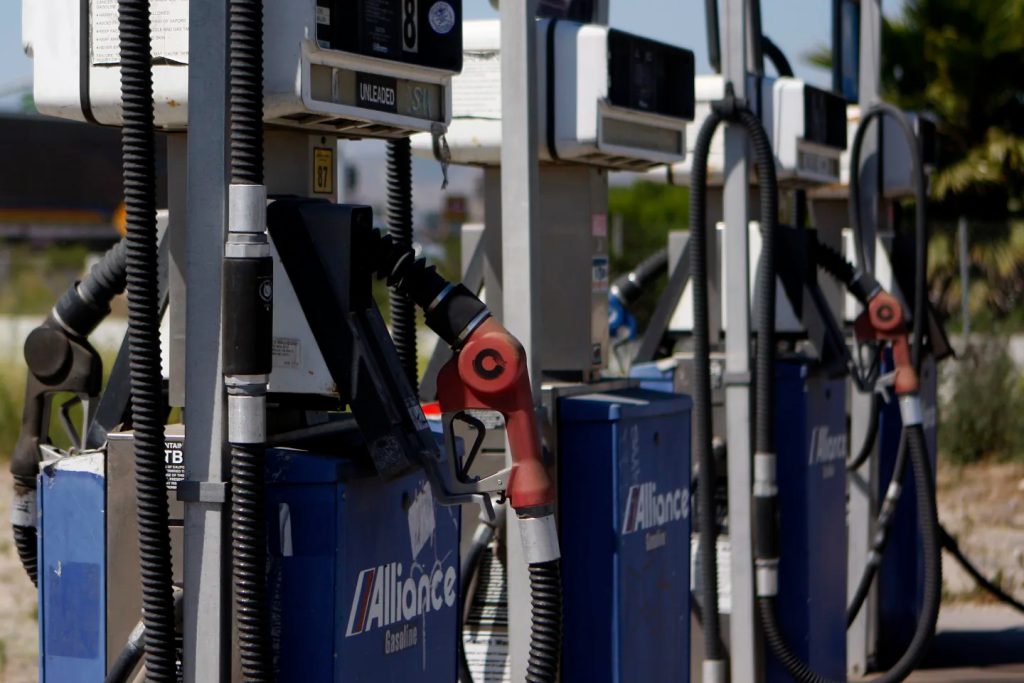 Close-up of several blue and white gas station fuel pumps.