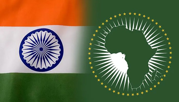 The national flag of India on the left and the green flag of the African Union featuring a map of Africa surrounded by gold stars on the right.