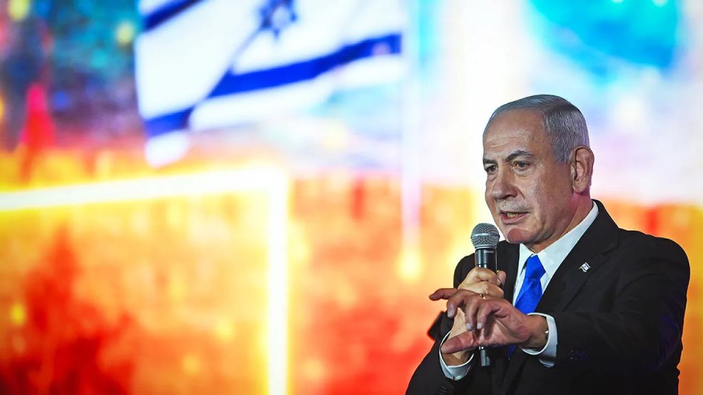 Israeli Prime Minister Benjamin Netanyahu speaking at a podium with an Israeli flag in the background.