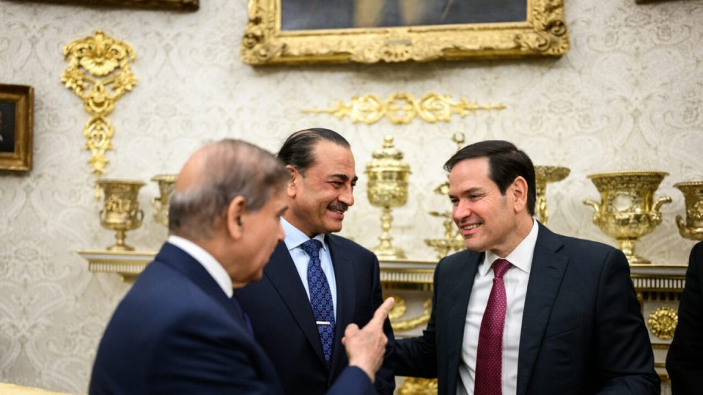 Asim Munir and Marco Rubio conversing in a formal setting.