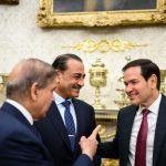 Asim Munir and Marco Rubio conversing in a formal setting.