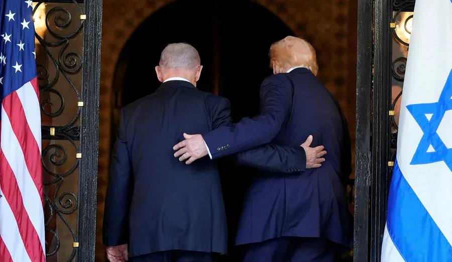 Former President Donald Trump and Benjamin Netanyahu seen from behind, standing between American and Israeli flags.