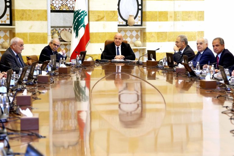 A formal meeting of Lebanese government officials seated around a large conference table with the Lebanese flag in the background.