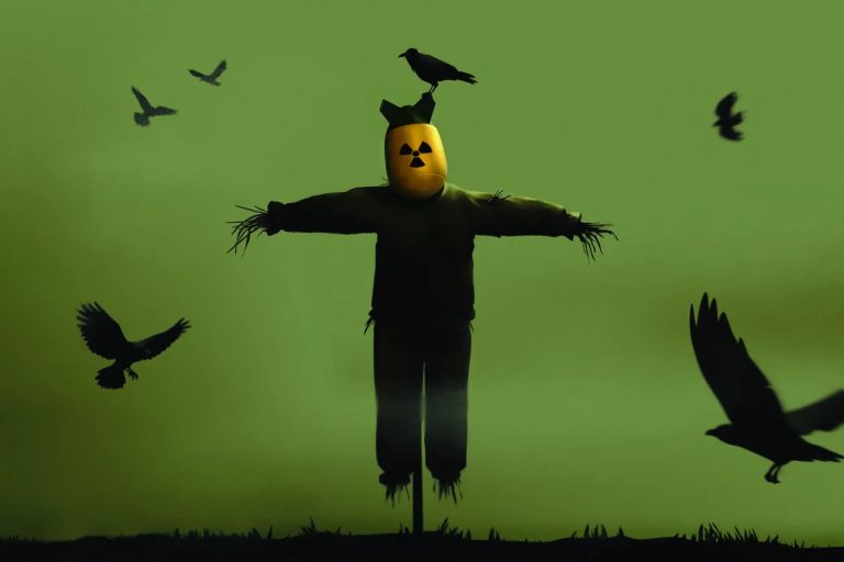 A symbolic scarecrow wearing a nuclear radiation hazard helmet with crows circling.