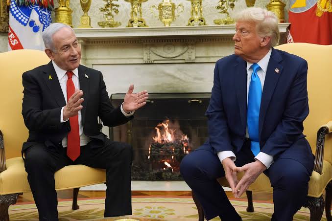 Donald Trump and Benjamin Netanyahu seated in chairs at the White House.