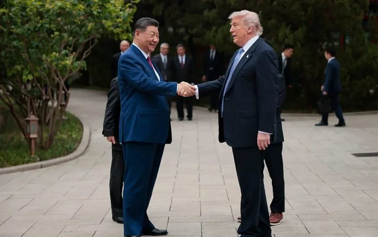 Trump and Xi Jinping shaking hands during a formal meeting.