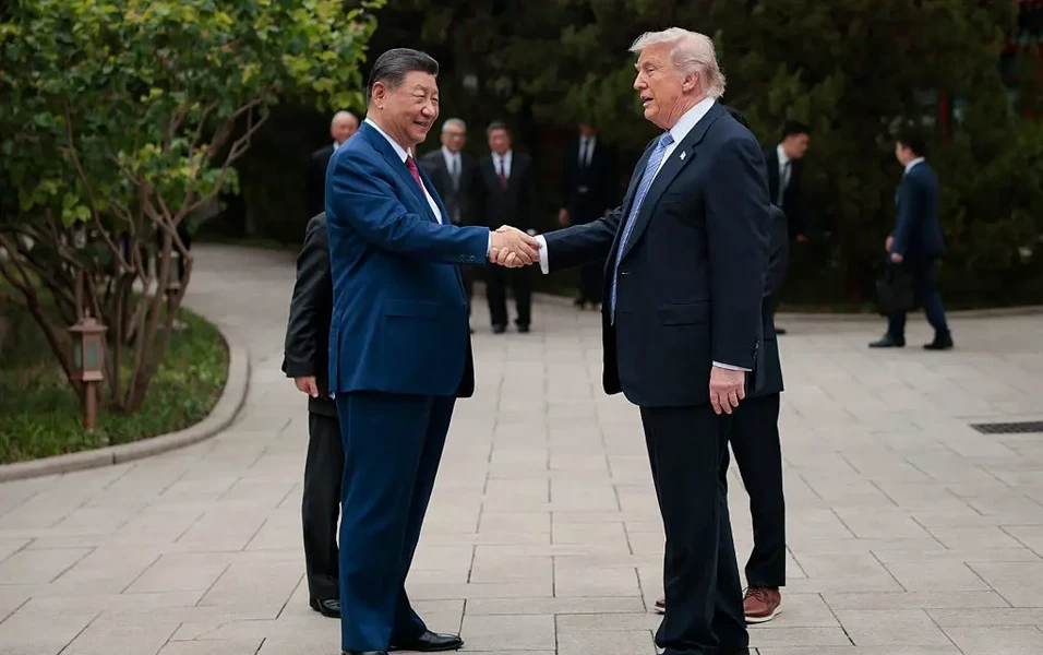 Trump and Xi Jinping shaking hands during a formal meeting.