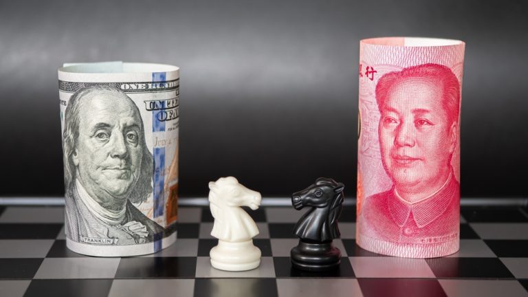 A chess board featuring a US dollar bill and a Chinese yuan bill facing off with knight pieces.