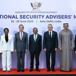 BRICS National Security Advisers stand in a line for a group photo at a summit in New Delhi.