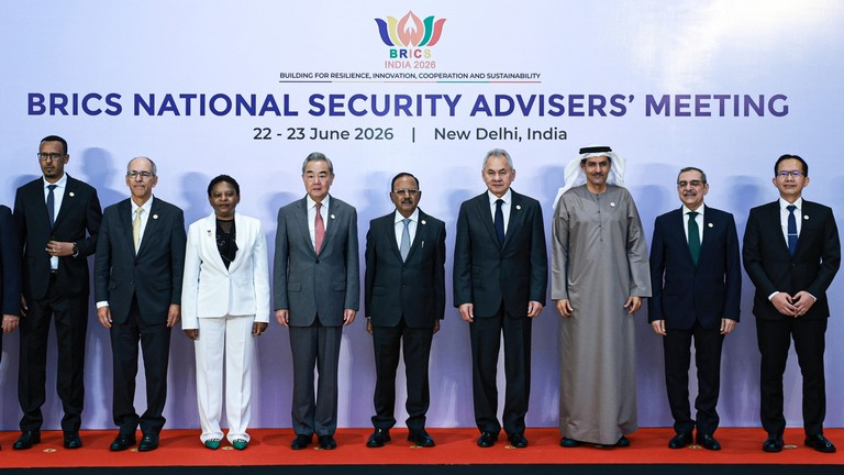BRICS National Security Advisers stand in a line for a group photo at a summit in New Delhi.