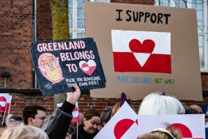 Protesters holding signs in Copenhagen expressing opposition to the potential U.S. purchase of Greenland.