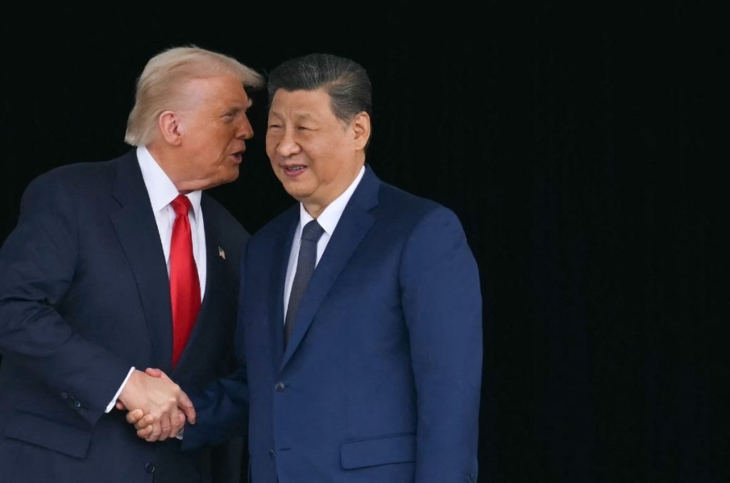 Donald Trump shaking hands with Xi Jinping.
