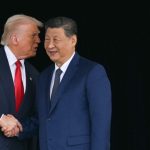 Donald Trump shaking hands with Xi Jinping.