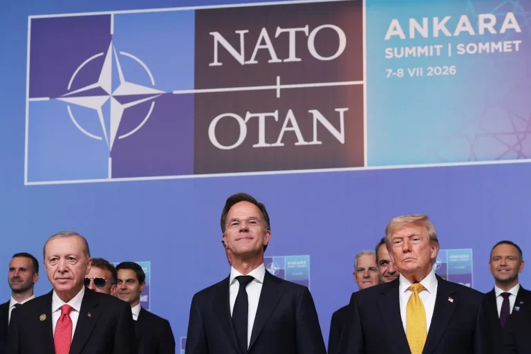 World leaders including Recep Tayyip Erdoğan, Mark Rutte, and Donald Trump standing together at the NATO summit in Ankara.