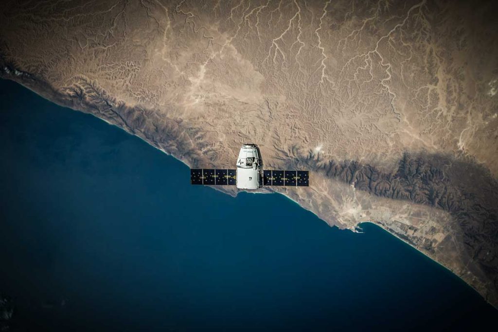 A satellite or spacecraft orbiting high above the Earth's surface.