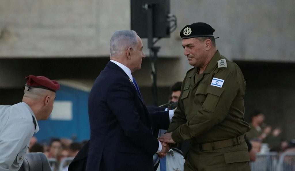 Benjamin Netanyahu shaking hands with a high-ranking Israeli military officer