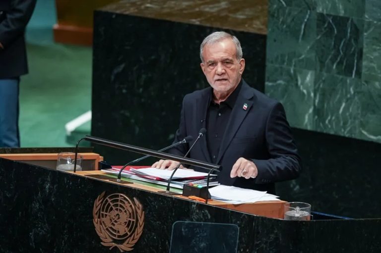 Iranian President Masoud Pezeshkian delivering a speech at the United Nations General Assembly podium.