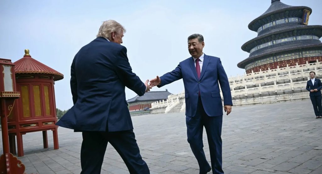 Donald Trump shaking hands with Chinese President Xi Jinping in Beijing.