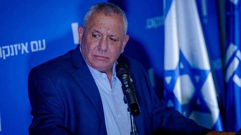 Israeli politician Gadi Eisenkot speaking at a press conference microphone.