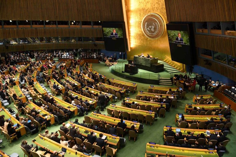 Wide-angle view of delegates gathered in the United Nations General Assembly hall during a high-level debate.