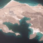 Satellite aerial view of Mayun Island with an airfield runway in the Red Sea.