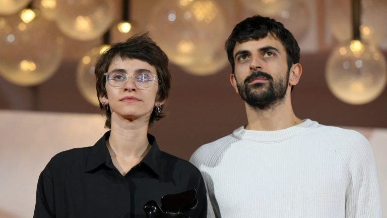 Filmmakers Basel Adra and Yuval Abraham standing together at an awards ceremony.