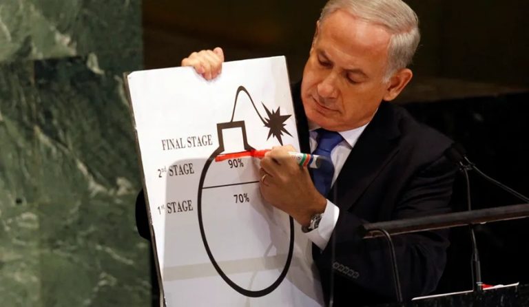 Benjamin Netanyahu drawing a red line on a cartoon bomb diagram at the UN General Assembly.