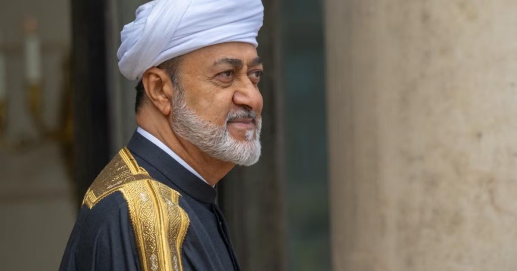 Sultan Haitham bin Tariq of Oman wearing traditional royal attire and a white turban.