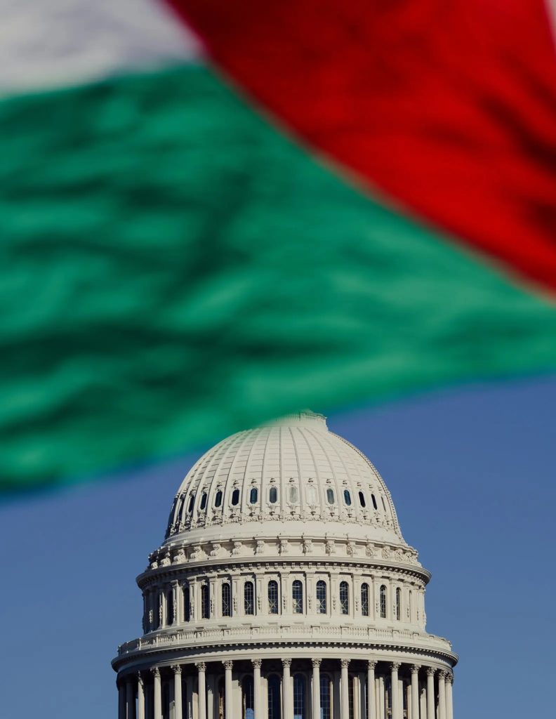 Close-up of the United States Capitol dome with the Palestinian flag unfurled in the background