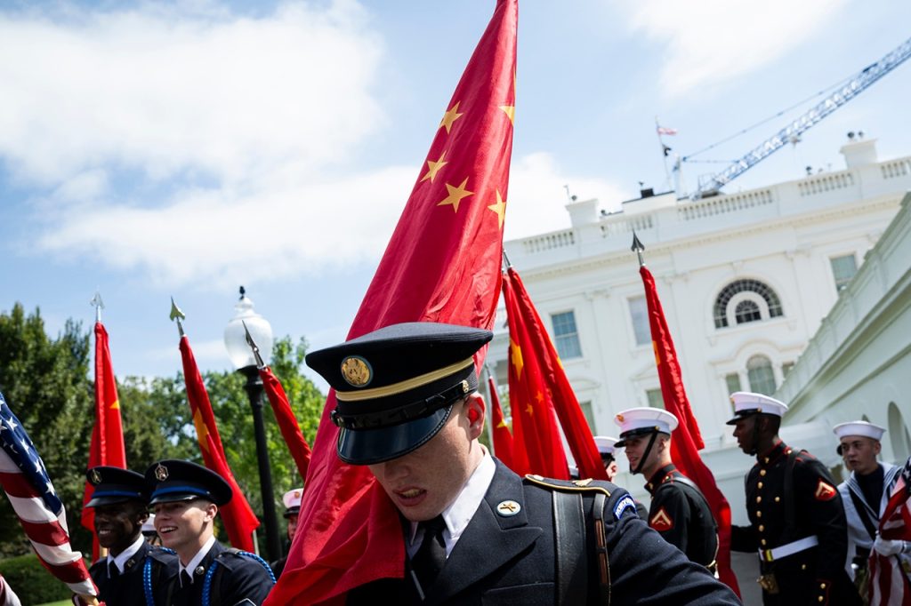 Military honor guard carrying the Chinese national flag outside the White House