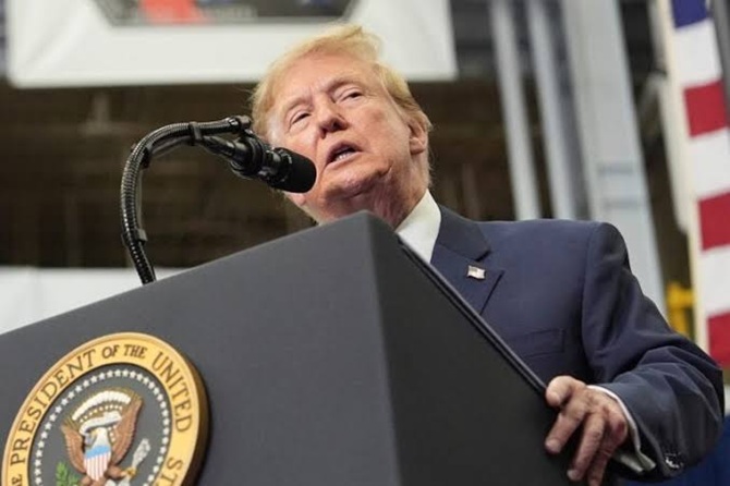 Donald Trump speaking at a podium bearing the Seal of the President of the United States.