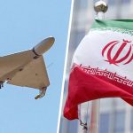 Iranian Shahed kamikaze drone flying against a blue sky alongside the national flag of Iran.