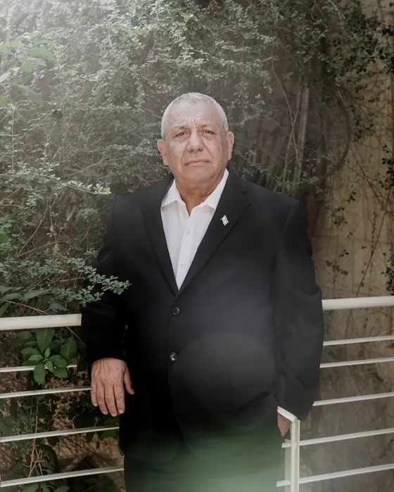 Portrait of Israeli politician and former IDF chief Gadi Eisenkot leaning against a railing outdoors.