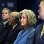 White House Chief of Staff Susie Wiles and senior Trump administration officials seated in a row with serious expressions.