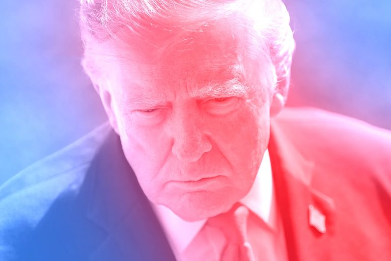 A close-up portrait of Donald Trump illuminated with striking red and blue lighting tones.